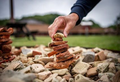 A pile of bricks set up for visitors to admire and interact with